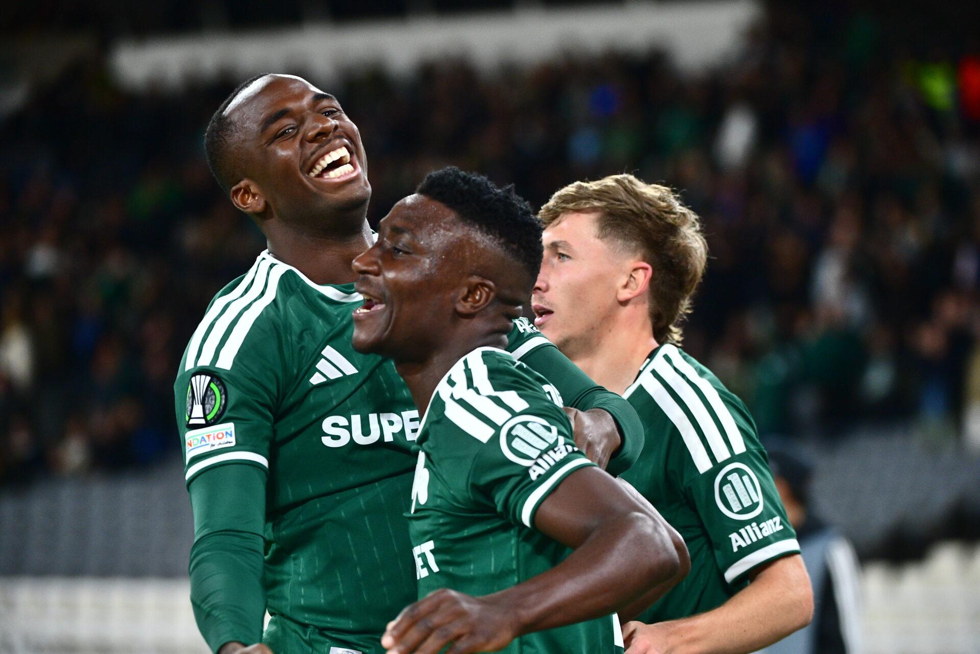 Panathinaikos football players celebrating a goal on the pitch